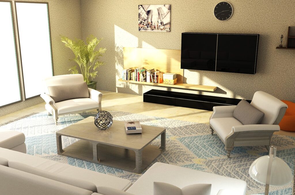 Living room with two chairs, couch, coffee table and plant with sunlight streaming in