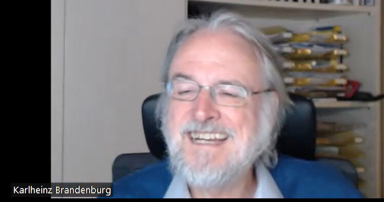 Brandenburg Labs Founder and CEO Dr. Karlheinz Brandenburg smiles against an office background with bookshelves