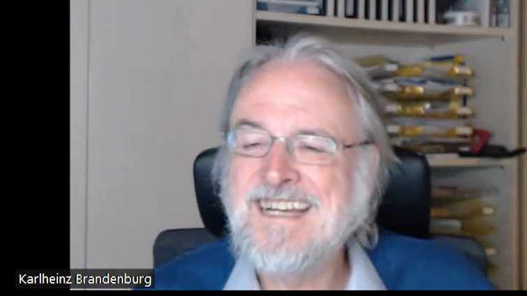 Brandenburg Labs Founder and CEO Dr. Karlheinz Brandenburg smiles against an office background with bookshelves