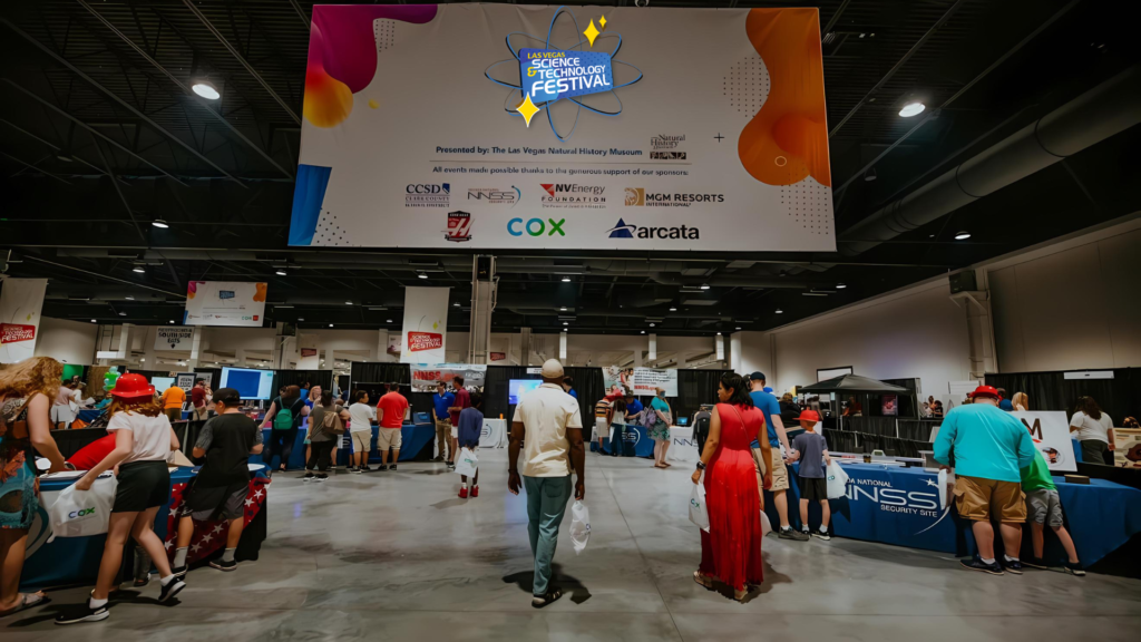 Parents and children walk through Las Vegas Science and Technology Festival.