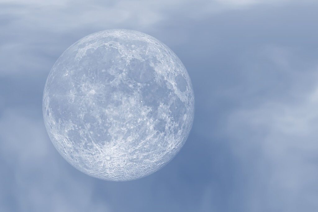 Misty photograph of a full Moon.