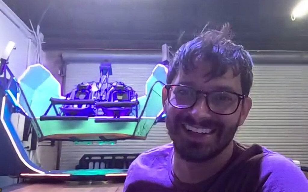 New World Rides CEO Dr. Nick Suttell smiles next to his revolutionary ride, the Roto Loco.