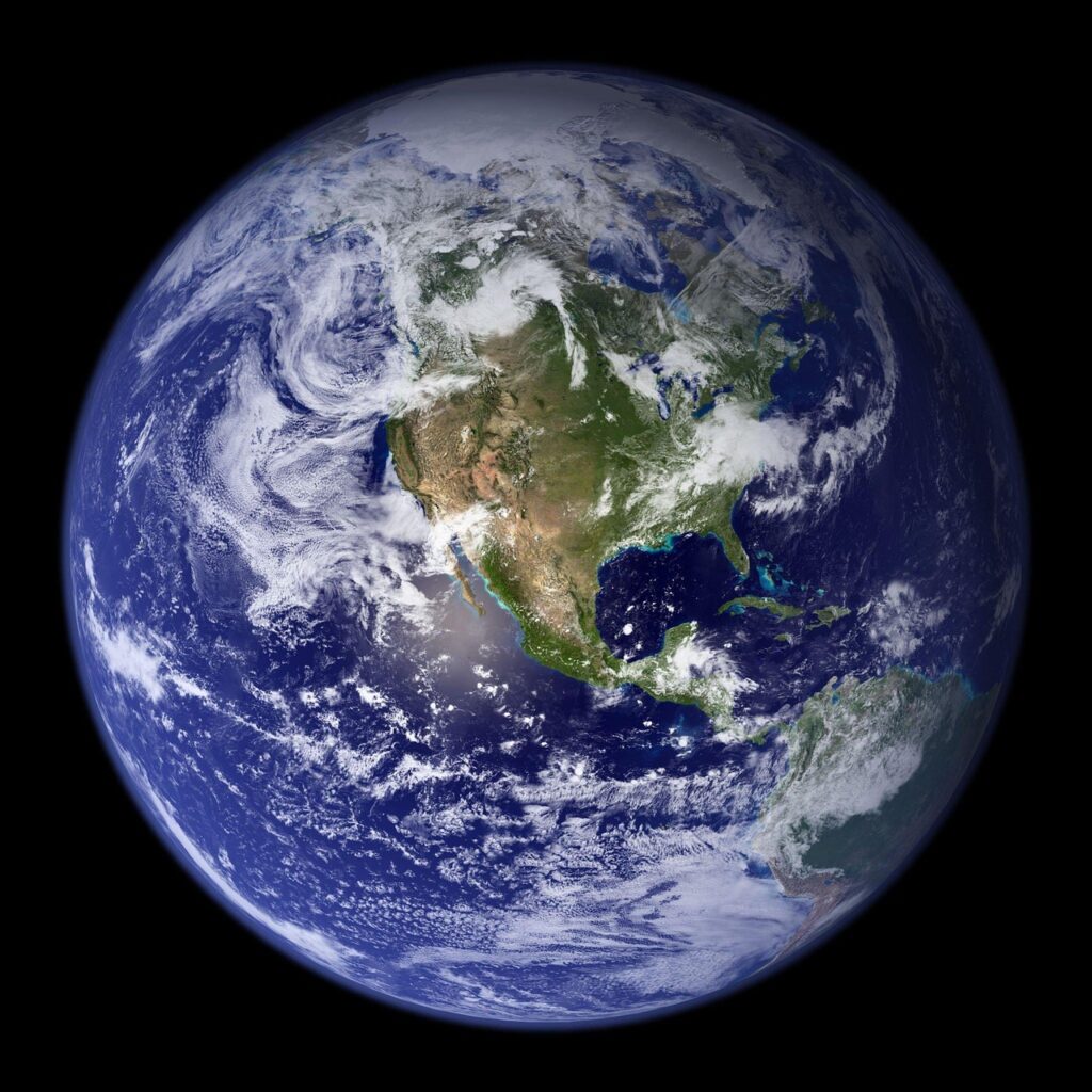 Earth as seen from space: a blue marble amid a black background.