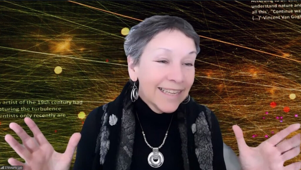 STEMarts Lab Founder and Director Agnes Chavez smiles as she explains a concept in front of a space-science SciArt Zoom background