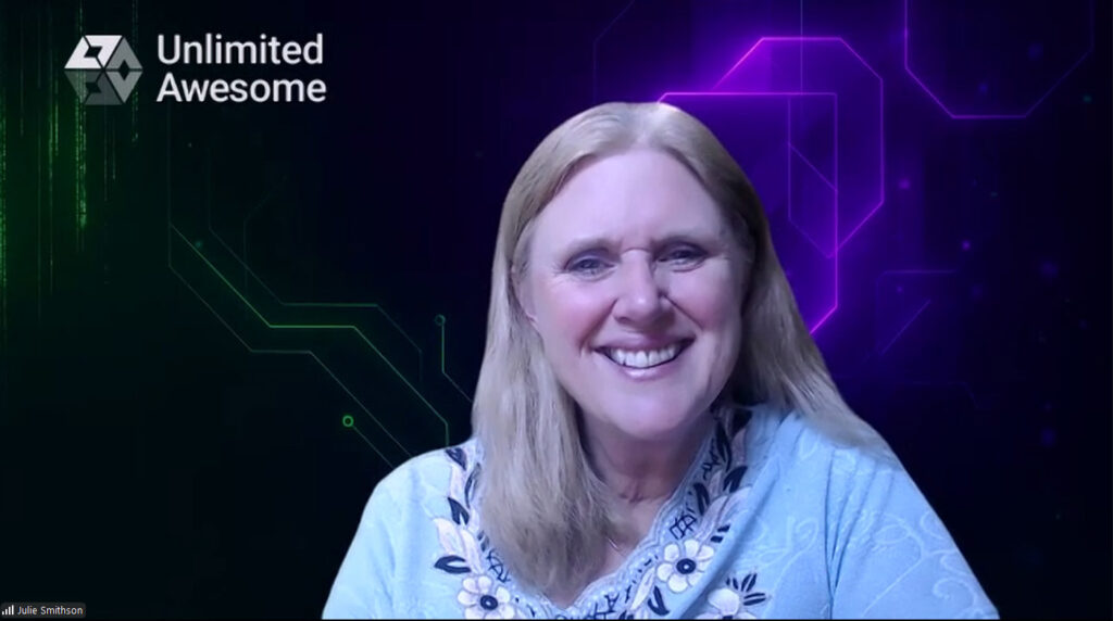 Unlimited Awesome Co-Founder/COO Julie Smithson smiles against a multicolored Zoom background with "Unlimited Awesome" lettered in the background.