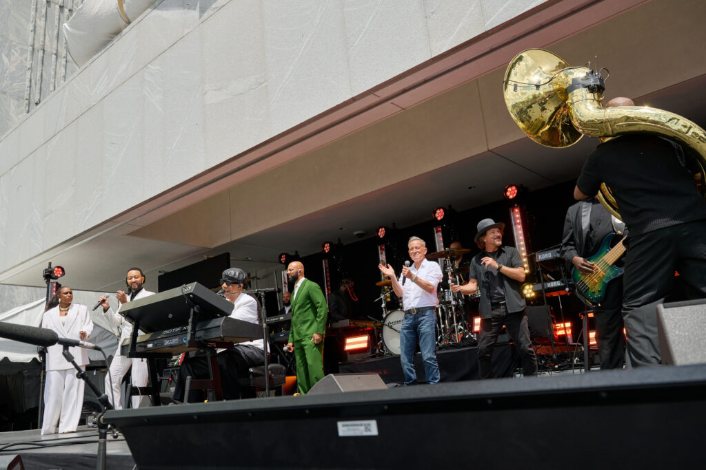 Stevie Wonder performs center stage as Bono, John Legend and Bruce Springsteen join him in a final number.