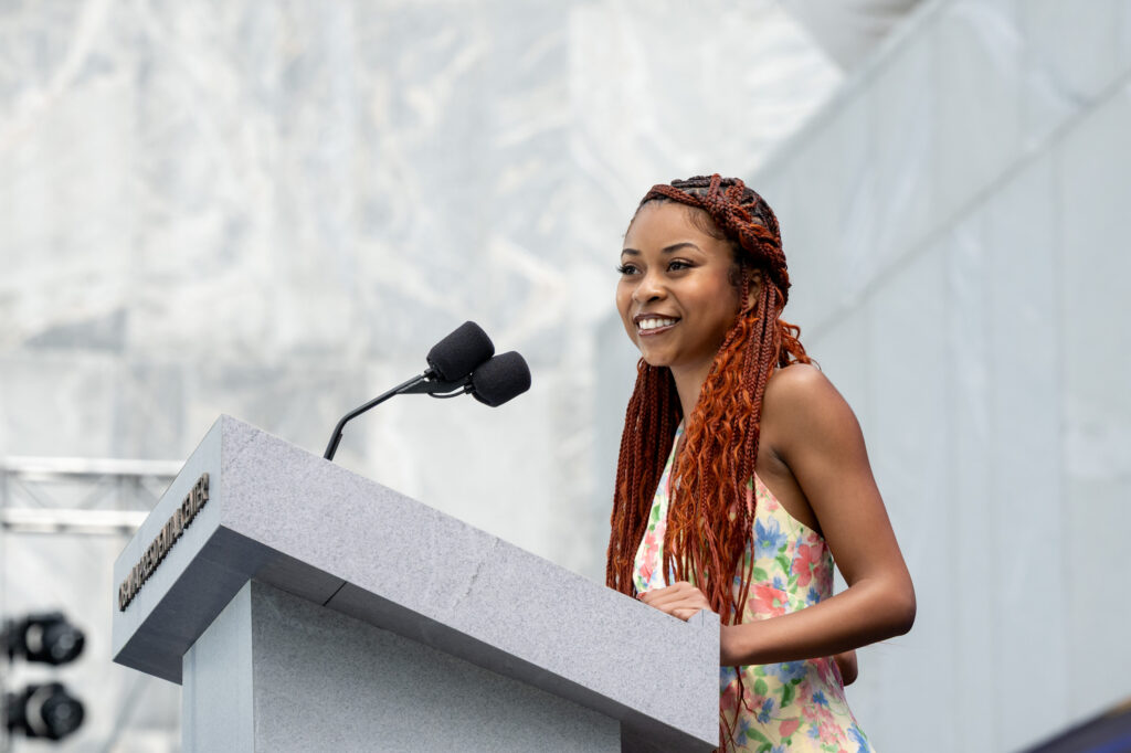 Addison Bellone, past participant in the Girl Opportunity Alliance introduces Mrs. Obama during the Grand Opening Dedication Ceremony at The Obama Presidential Center