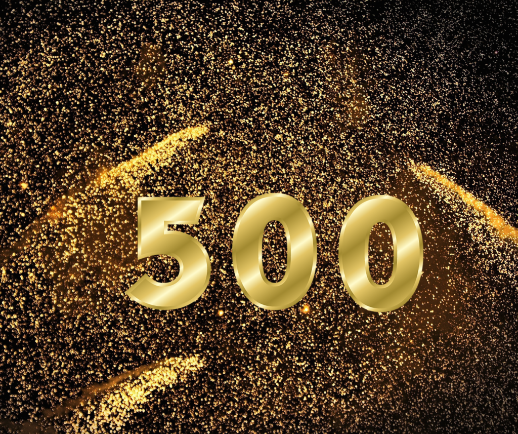 Gold numerals "500" against a night sky filled with gold fireworks for Show 500